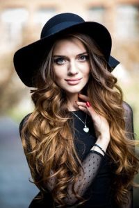 curly-festival-hair-with-hat-200x300